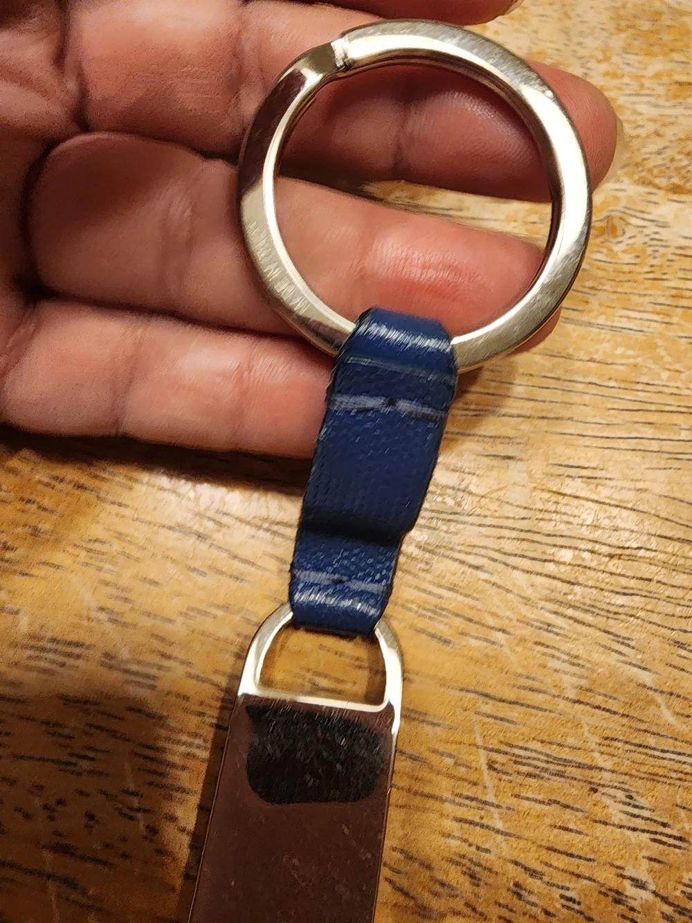 blue leather Fendi logo plaque keychain features silver-tone hardware